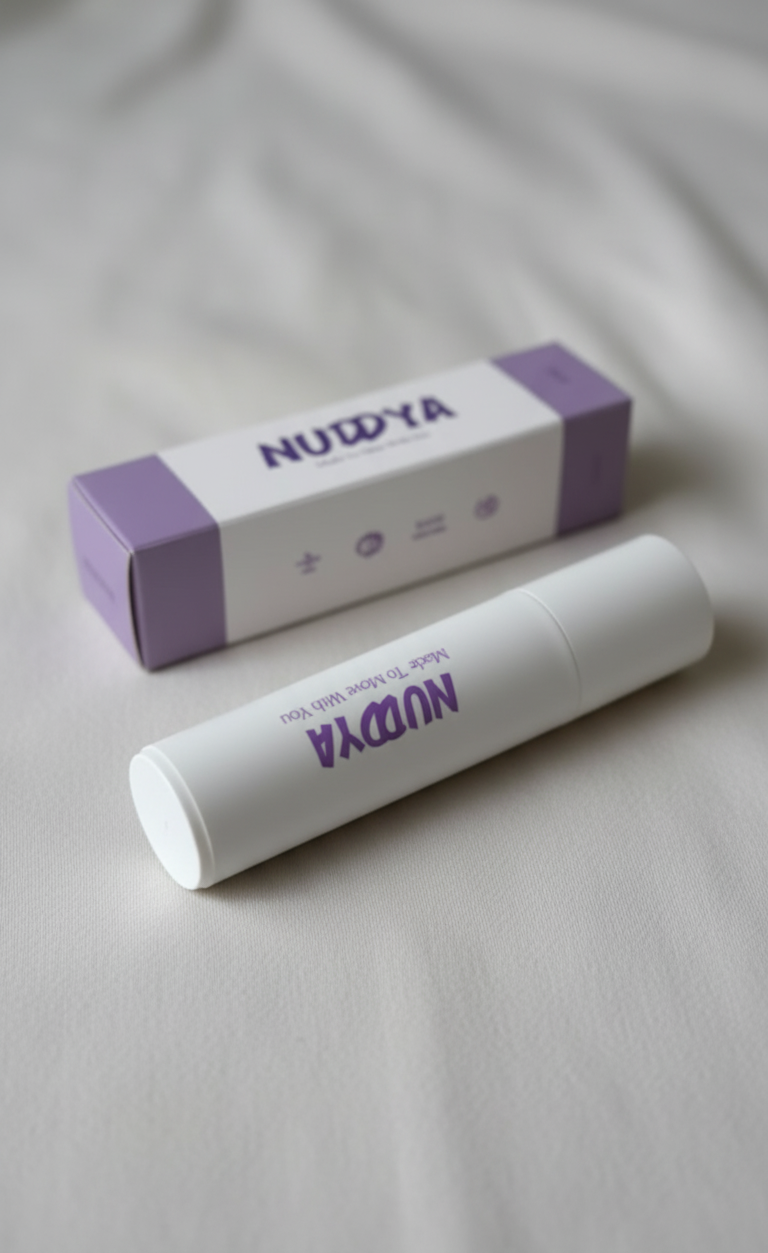 NUDYA body glue and packaging on a light gray background